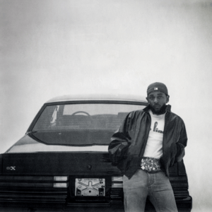 Cover of Kendrick Lamar’s 2024 album GNX featuring Kendrick Lamar standing beside a black Buick GNX against a minimalist white background.