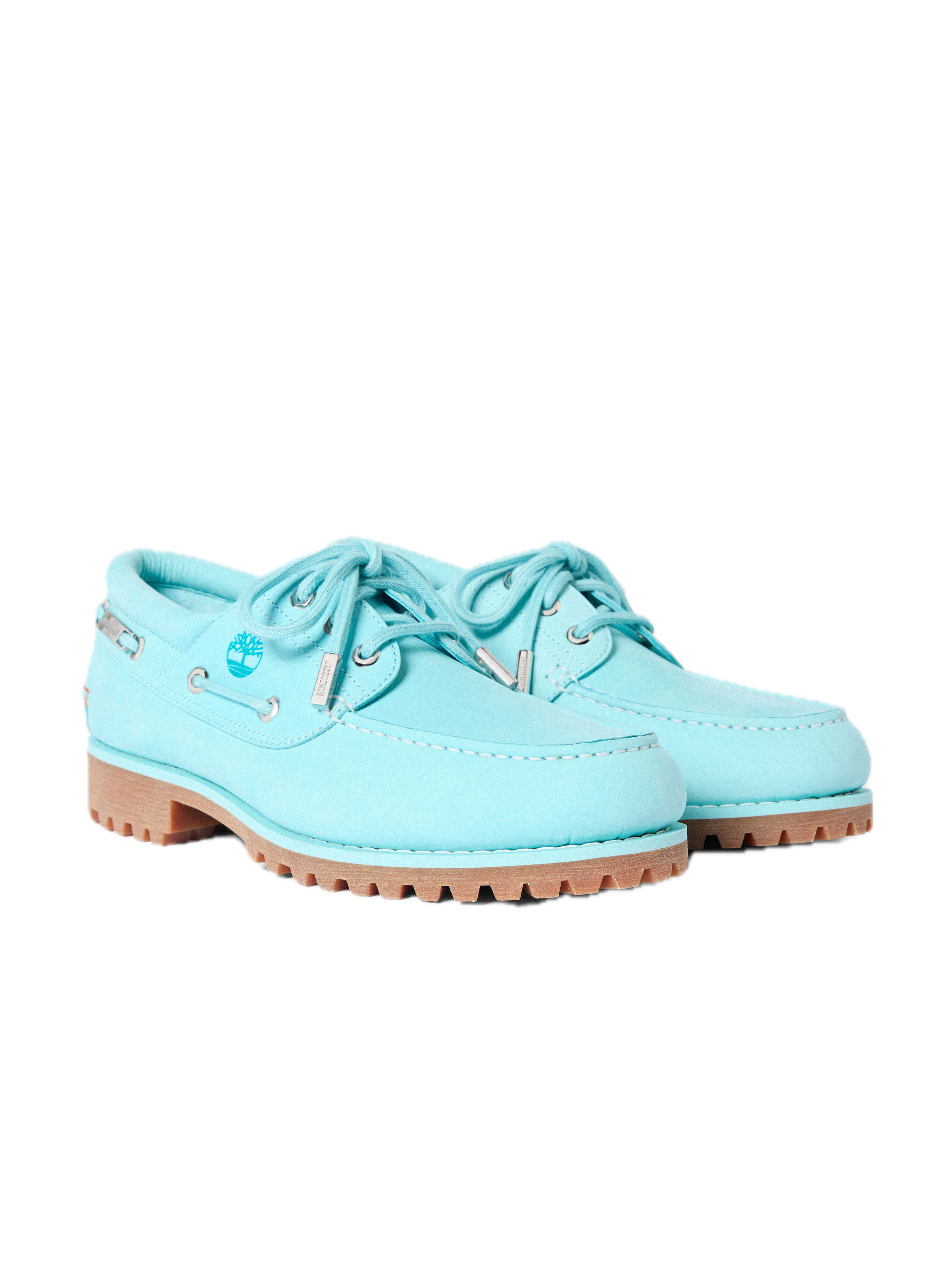 Pair of Timberland x Jacquemus Authentic Boat Shoes in Lagoon Blue displayed at an angle, showcasing premium leather construction, tonal stitching, and signature gum lug soles.