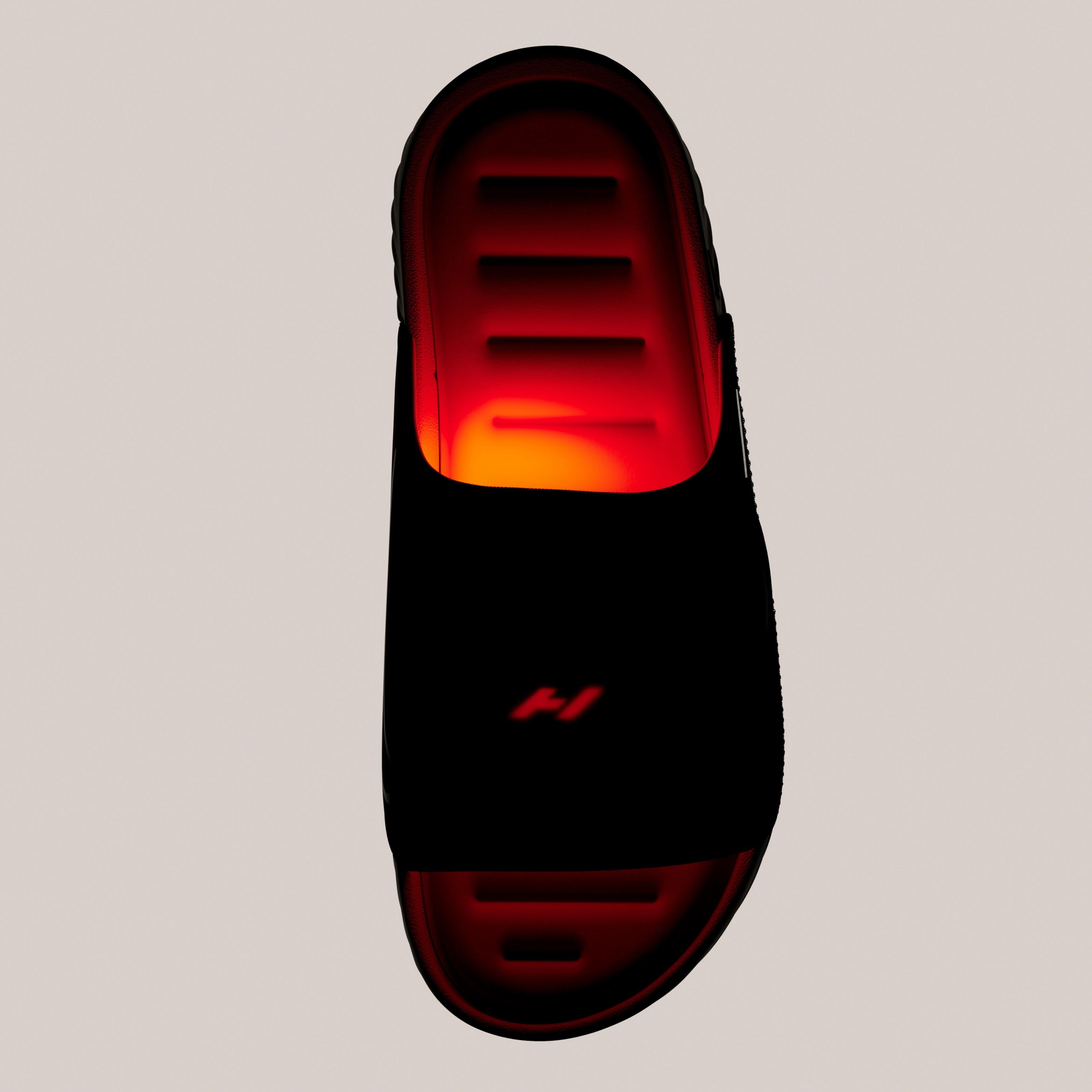 Top-down view of the Nike Air Zoom Hyperslide highlighting the glowing heated footbed and Hyperice-powered recovery system built into the slide.