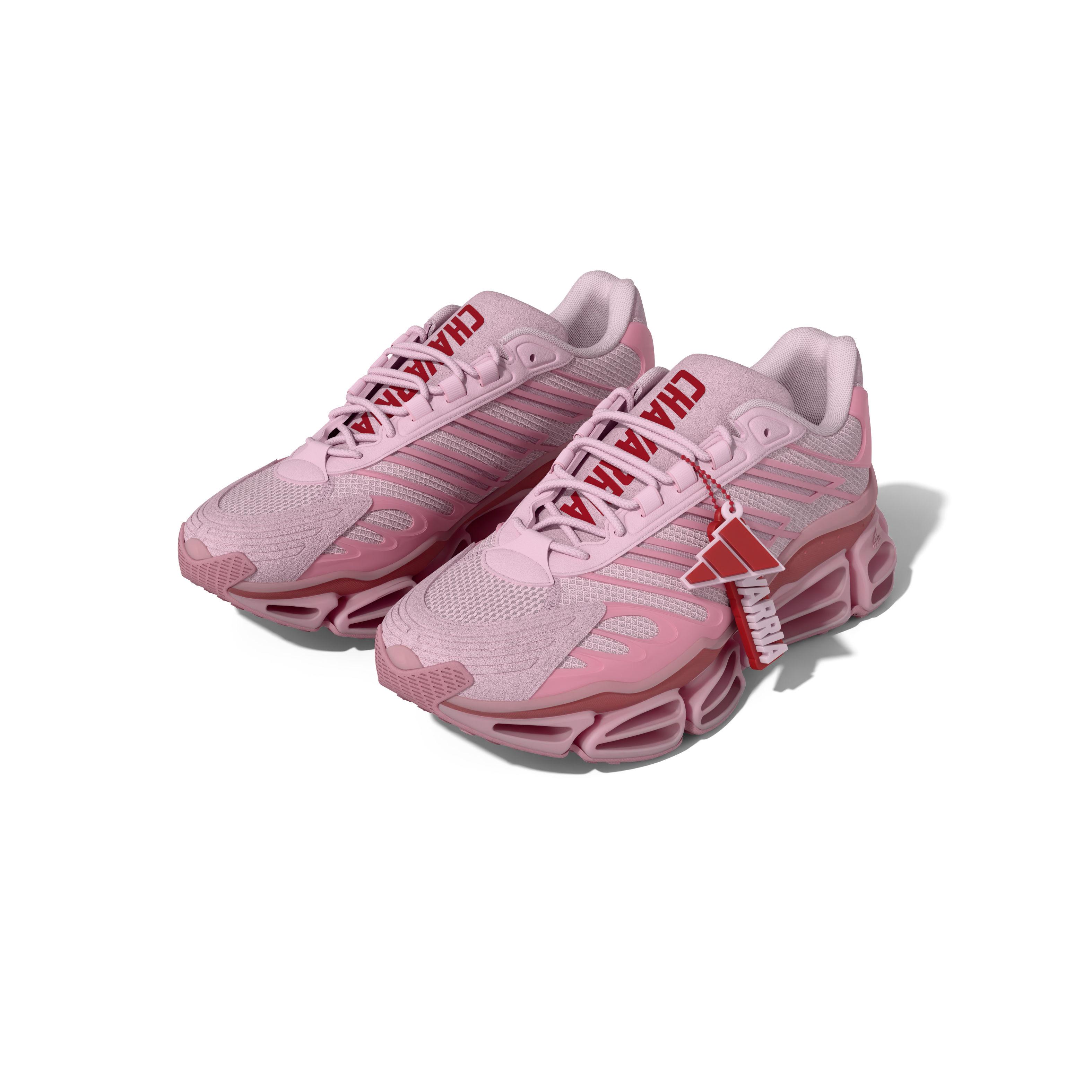 Angled view of the adidas Originals x Willy Chavarria Megaride AG in an all-pink colorway with premium mesh, suede overlays, and a removable Chavarria silicone keychain charm.