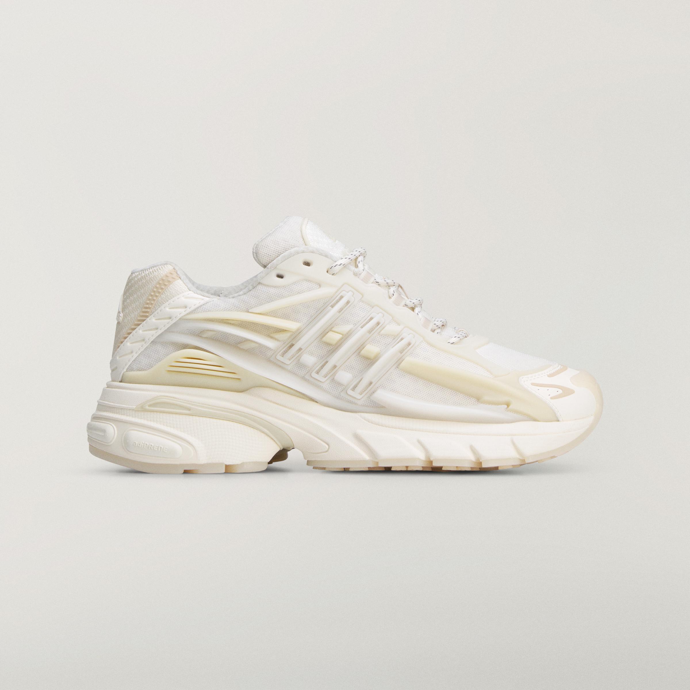 Side profile of the adidas Originals x Pharrell Williams VIRGINIA Adistar Jellyfish sneaker in the Triple White colorway.